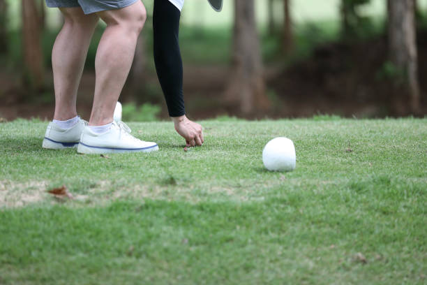 istock Close up golf ball on green grass 1820557207
