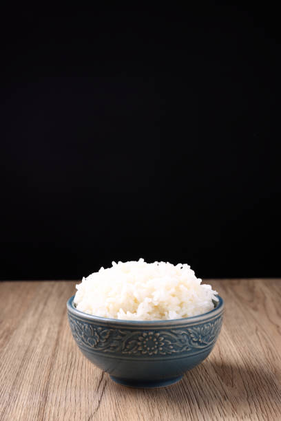 istock Thai rice isolated on wood background 1820557737