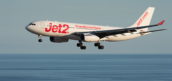 Tenerife, Spain June 4st, 2023. Airbus A330-243 of Jet2 Airlines flies in the blue sky over the ocean