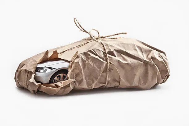 A car wrapped in brown paper.