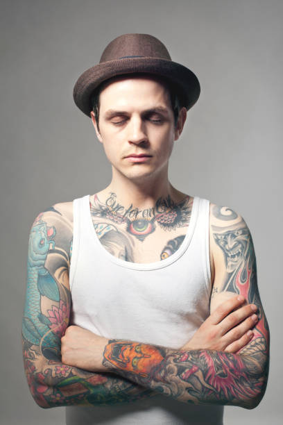 Portrait Of A Tattooed Man Stock Photo - Download Image Now - Eyes Closed,  Front View, Gray Background - iStock