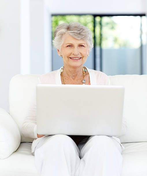 istock Relaxing in the lounge with a laptop - Retirement 182058372