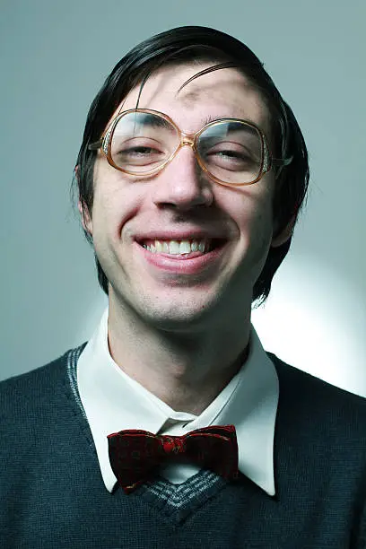 Portrait of nerd student with retro glasses