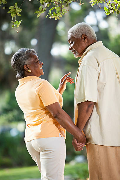 istock Senior African American couple holding hands 182058777