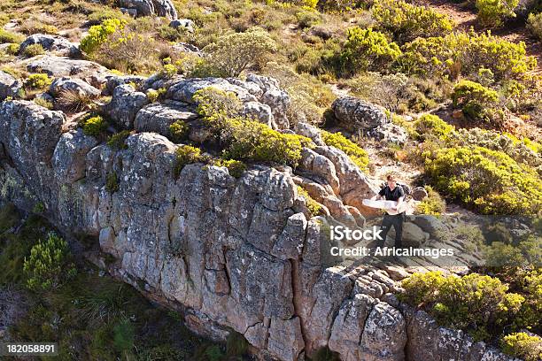 Hiker Reading A Map Stock Photo - Download Image Now - 20-29 Years, Active Lifestyle, Adult