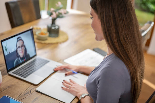 istock Smiling Female Worker Attending Video Call 1820590579