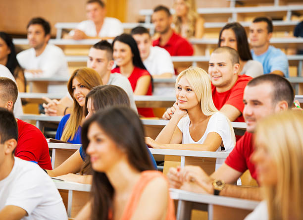istock Large group of students listening to a lecture. 182059068