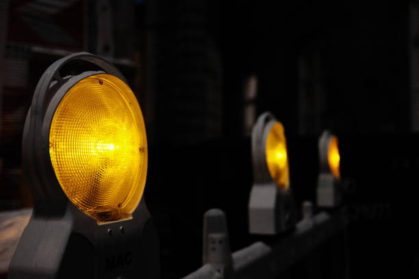 istock Yellow lights at a construction site with focus on the foreground 1820596204