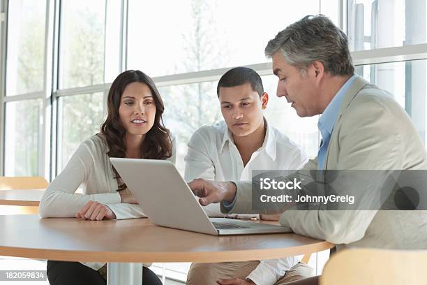 Man Explaining An Investment Plan To Couple Stock Photo - Download Image Now - Financial Advisor, Customer, Meeting