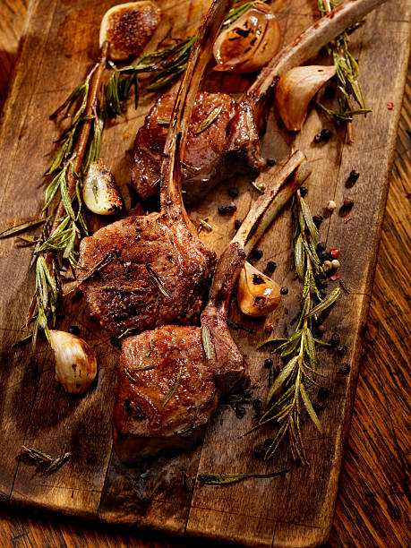 Braised Lamb Chops "Rack of Lamb with Garlic, Rosemary and Peppercorns - Photographed on Hasselblad H3D2-39mb Camera" rack of lamb stock pictures, royalty-free photos & images