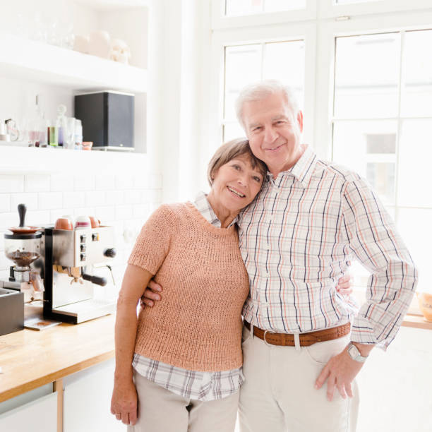istock Seniors grandparents standing embraced on a Kitchen 182060067