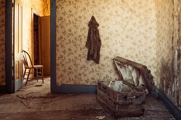 "A rickety old chest and chair in an abandoned house in the old gold mining town of Bodie, California."