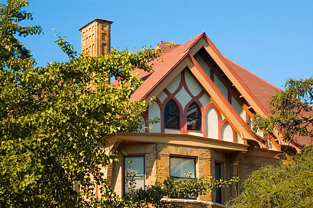 istock European home surronded by foliage 182060982