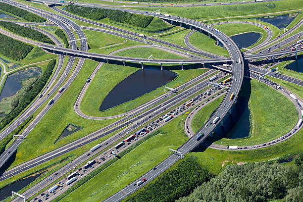 toma cenital de highway interchange - highway traffic aerial view netherlands fotografías e imágenes de stock
