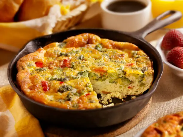 "Cheese and Broccoli Frittata with Roasted Red Peppers, Coffee, Orange Juice and Croissants - Photographed on Hasselblad H3D2-39mb Camera"