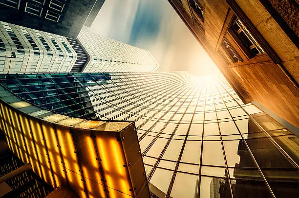 "Office skyscraper Reflection in the sunlight. Cross processed. Frankfurt, Germany"
