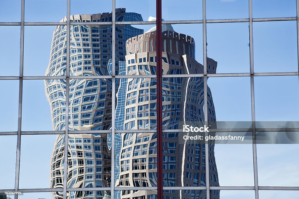 Boston Skyscraper Reflection International Place in Boston MA is reflected in the windows of another highrise building.Similar: Distorted Stock Photo