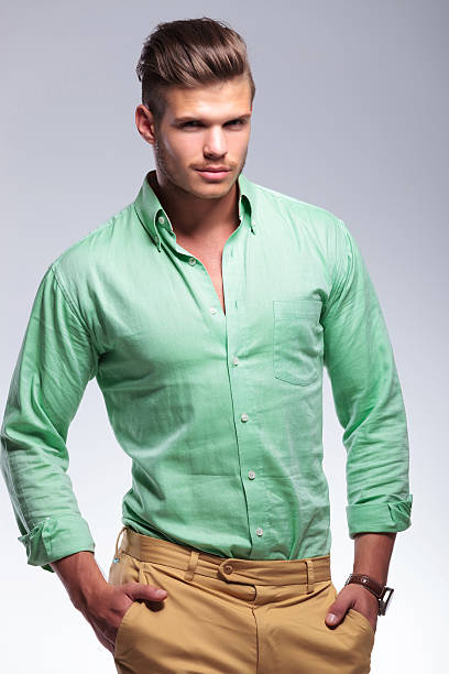 istock casual man with fingers in pockets 182062456