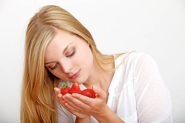 istock Young woman with strawberries 182062977