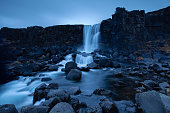 Tranquil view of Öxarárfoss waterfall in Thingvellir National Park in Iceland at dusk