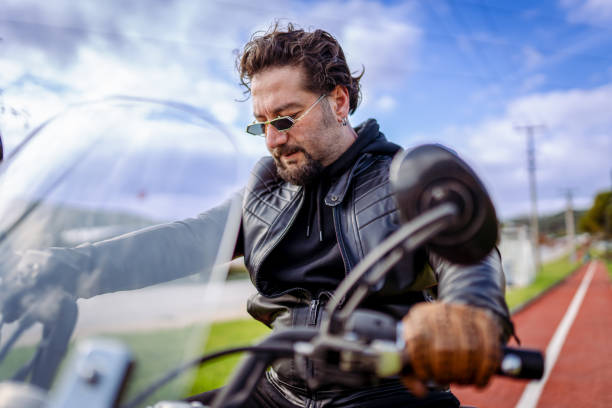 istock Millennial man and his dog riding motorcycle 1820642692