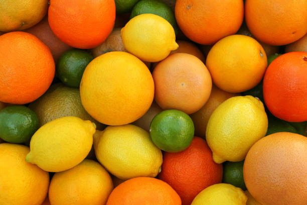 istock Many different whole citrus fruits as background, top view 1820648042