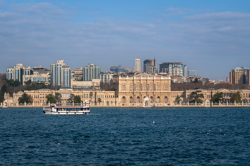 Istanbul, Turkey, , 02.25.2023: View of Dolmabahce Palace in Besiktas district on the European shore of the Bosphorus Strait on a sunny day
