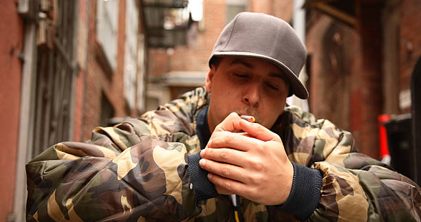 Young Man Lighting a Smoke stock photo