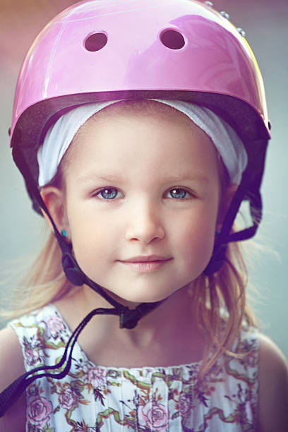Little girl in a safety helmet Little girl in a safety helmet. gir forest national park stock pictures, royalty-free photos & images