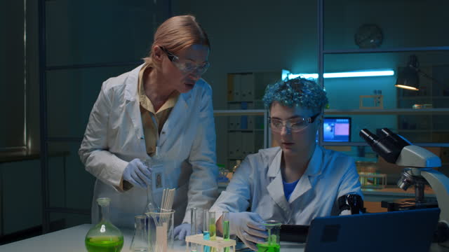 Two Diverse Female Chemists Working in Research Lab