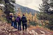 Family looking at view in High Tatra Mountains, Slovakia on an autumn day