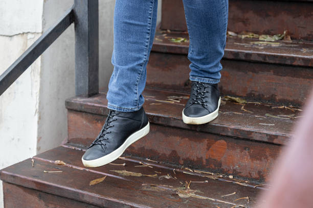 istock man going down wooden stairs in rainy weather. 1820664530