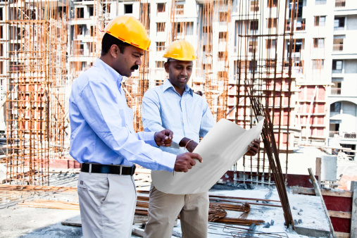 engineer and architect on cconstruction site in India