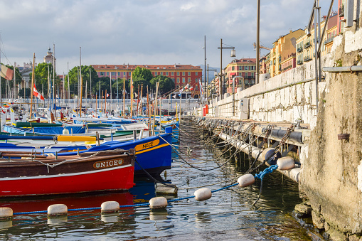 Nice, France - July 6 2019: moored colourful boats in Port Lympia, daytime view