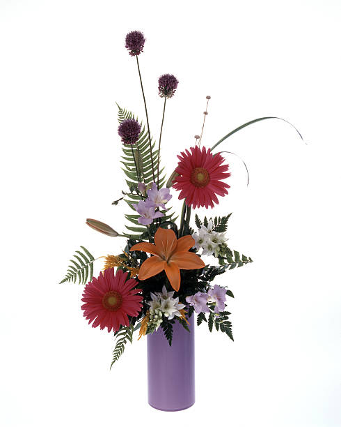 Colorful flower bouquet arrangement in vase isolated on white