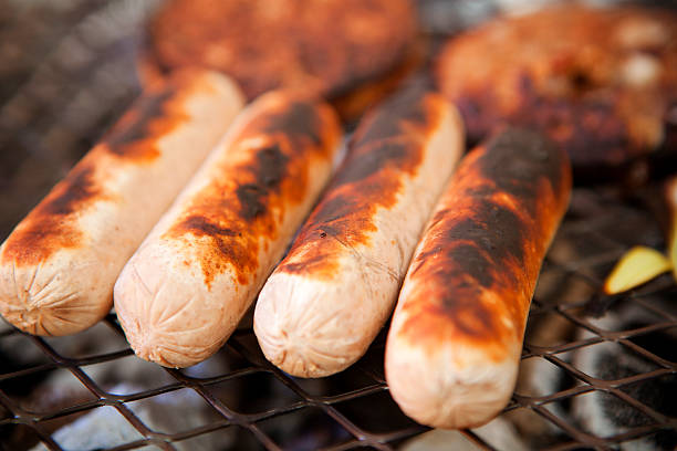istock sausages cooking on the bbq 182067153