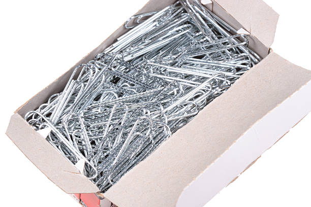Box of paperclips stock photo