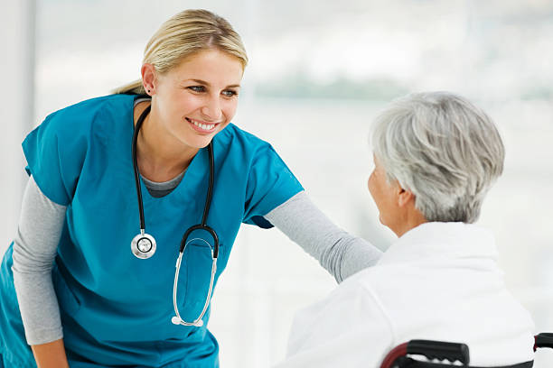 istock Young Doctor Speaking With an Elderly Patient 182068575