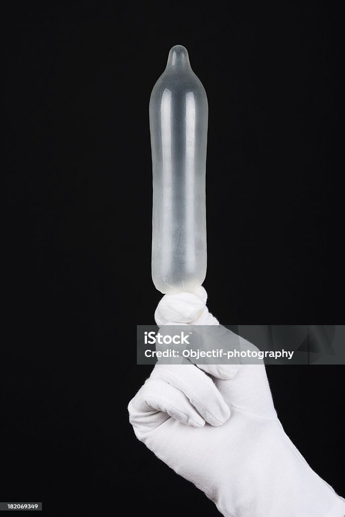 Preservativo gonfio - Foto stock royalty-free di Guanti formali