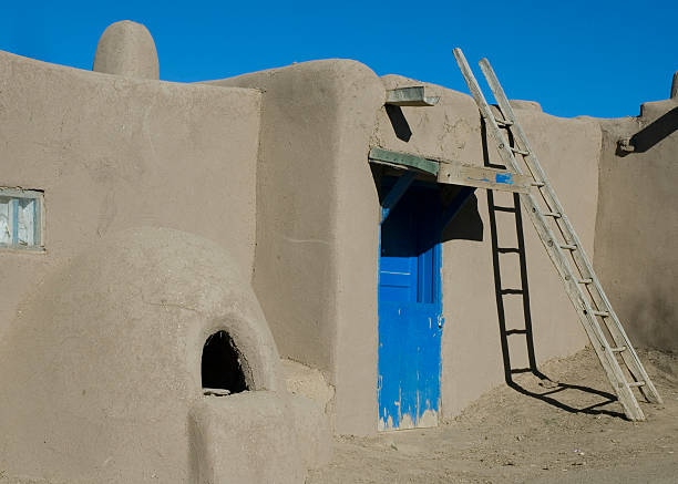 Examples of the  adobe architecture of Taos Pueblo,  in New Mexico, a multistory adobe complex inhabited by Native Americans for centuries. A longtime artist colony, Taos also offers many galleries and museums showcasing regional artwork, including the Harwood Museum of Art and the Taos Art Museum.  This is a popular tourist destination for travelers to the Sant Fe area.