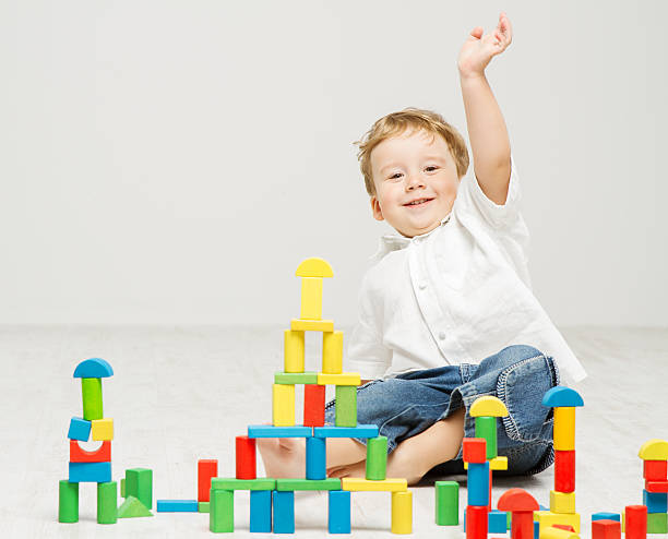 istock Child playing toys blocks 182072211
