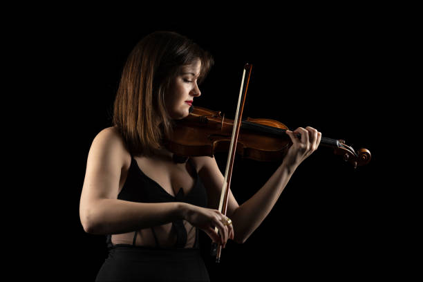 istock Young violinist woman playing the violin 1820738261