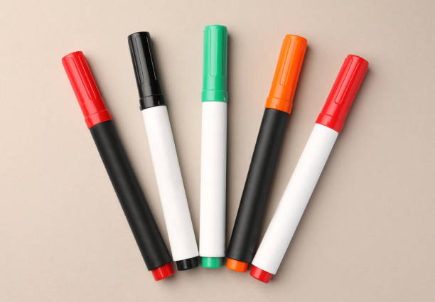 istock Bright color markers on beige background, flat lay 1820744262