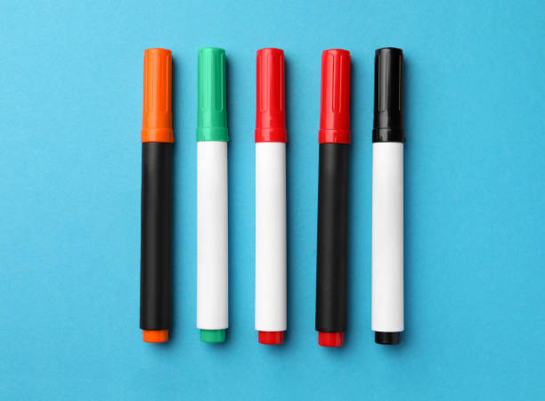 istock Bright color markers on light blue background, flat lay 1820745343