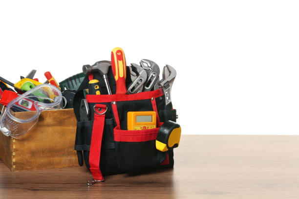 istock Crate and bag with tools on wooden table against white background 1820755762