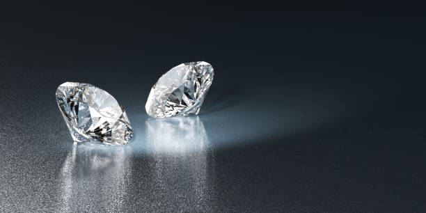 istock Round brilliant diamonds couple places on glossy background 3D rendering 1820757940