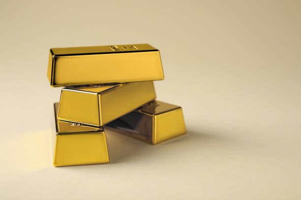 istock Many shiny gold bars on beige background. Space for text 1820762876
