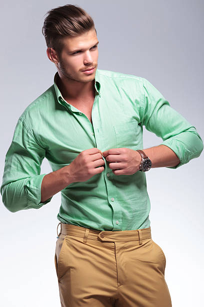 istock casual man unbuttoning his shirt 182077099