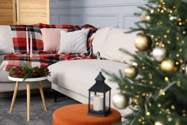 istock Christmas decor, lantern with candle and sofa in living room 1820771596