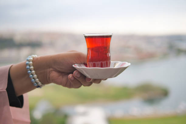 istock women holding Traditional turkish tea 1820771887